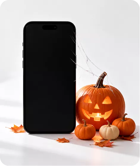Telefon z filmem Pomelo i halloweenowe dynie